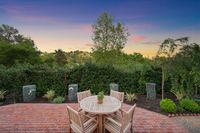 041 - 154 - 6 Snowberry Lane - Twilight view of the garden with table and chairs
