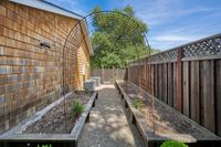 043 - 144 - 6 Snowberry Lane - Wooden fence and a row of raised beds