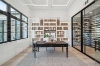 009 - 2990 Limestone Road - Office center table, shelves and wine room