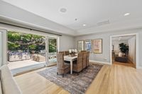 09 - 390 Castello Road - Dining table and open glass door that leads outside