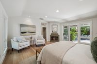 24 - 390 Castello Road - 2 corner chairs at the primary bedroom and fireplace