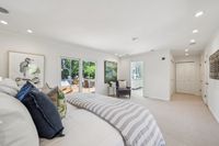 023 - 19 Warwick Court - Primary bedrom and an open door that leads to the bathroom