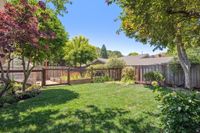 33 - 1245 Rimer Drive - Large level lawn and gate that leads to the garden beds