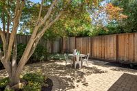 36 - 1245 Rimer Drive - Backyard patio with a round table and metal chairs