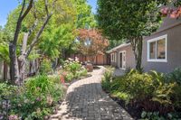 37 - 1245 Rimer Drive - Garden pathway that leads to the backyard porch