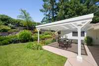 034 - 3190 Bavarian Lane - Covered patio area with a white pergola and a outdoor dining set