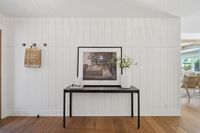 05 - 3108 Del Oceano Drive - Table with a white vase and painting