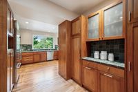 12 - 063 - 25 Haciendas Road - Prep area or pantry with wood cabinetry, green tiled countertops