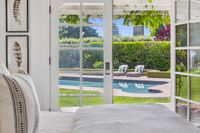 24 - 31 Old Millstone Lane - Open door showing the swimming pool and 2 lounge chairs