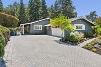 036 - 3165 Lucas Drive - Gated driveway with paver courtyard and attached two-car garage.