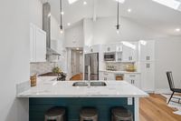 007 - 973 4th Street - Kitchen with a white center island and seating.