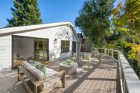 015 - 973 4th Street - Spacious deck with outdoor seating and lush tree views.