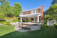17.25 - 231 Sundown Terrace - Back of the house with a patio, outdoor bar seating, and landscaped yard