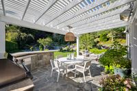 15 - 231 Sundown Terrace - Patio with pergola, outdoor dining area, and built-in grill overlooking a landscaped yard