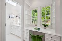 033 - 231 Sundown Terrace - Built-in desk area with white cabinetry, open shelving,  adjacent to a bathroom