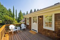 41 - 231 Sundown Terrace - Wooden deck with two chairs outside of the house.