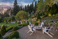 55 - 231 Sundown Terrace - Twilight view of the garden and firepit with chairs