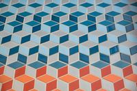 36 - 840 Broadmoor Court - Colorful geometric tile pattern with a 3D cube design.