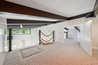 39 - 840 Broadmoor Court - Cozy carpeted loft area with decorative rope railing and exposed beams.