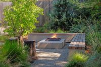 43 - 840 Broadmoor Court - Outdoor fire pit area with built-in bench seating and lush landscaping.