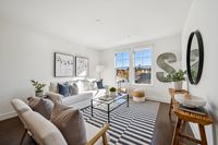 7 _ 1000-dewing-ave-214-bright-living-room-with-striped-rug