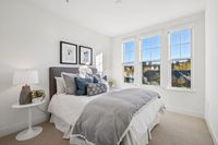 16 _ 1000-dewing-ave-214-secondary-bedroom-with-three-windows