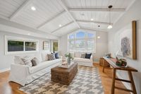 19 _ 849 Sibert Court _ Bright family room with vaulted ceiling, large windows, and cozy seating area