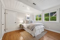 23 _ 849 Sibert Court _ Bright bedroom with vaulted ceiling, large windows, and cozy neutral decor