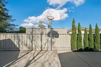 37 _ 342 Constance Place _ Outdoor basketball hoop with paved play area and privacy fence