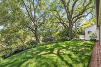 10 _ 1089 Rahara  Drive _ Backyard with lawn and surrounding trees