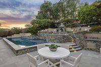 20 _ 1089 Rahara  Drive _ Outdoor area with pool, seating, and evening lighting
