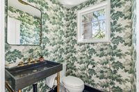 25 _ 1089 Rahara  Drive _ Bathroom with sink, toilet, and patterned wallpaper