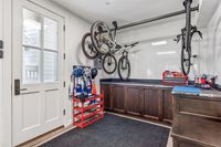 49 _ 1089 Rahara  Drive _ Storage area with cabinets, hanging bikes, and gear storage