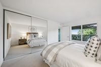 33 _ 665 Sky Hy Circle _ Bedroom with mirrored closet doors and large picture window views