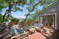 7 _ 996 Hawthorn Drive  _ Deck with outdoor seating and tree-lined outlook