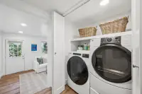 23 _ 996 Hawthorn Drive  _ Laundry closet with stacked washer and dryer unit
