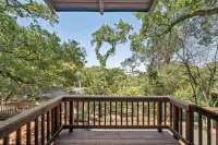 25 _ 996 Hawthorn Drive  _ Wood deck with railing and tree-filled backyard views