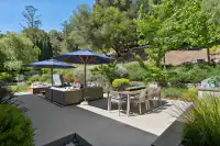16 _ 31 Sandy Court _ Outdoor entertaining area with dining space, spa and landscaped surroundings