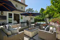 18 _ 31 Sandy Court _ Outdoor seating area with spa and garden surroundings