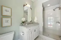 24 _ 31 Sandy Court _ Bathroom with vanity and glass-enclosed shower