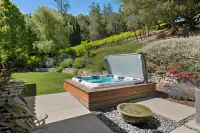 23 _ 31 Sandy Court _ Outdoor spa area with landscaped garden views
