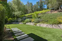 40 _ 31 Sandy Court _ Landscaped backyard with stone pathway