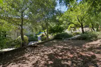 45 _ 31 Sandy Court _ Wooded garden area with shaded pathway
