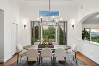 7 _ 21 Nemea Lane _ Formal dining room with large windows and outdoor views