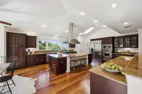 14 _ 21 Nemea Lane _ Kitchen with a central island, stainless steel appliances, and extensive cabinetry throughout the space