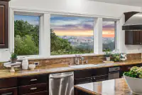 15 _ 21 Nemea Lane _ Kitchen with center island, stainless steel appliances, and hardwood flooring