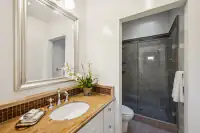 31 _ 21 Nemea Lane _ Bathroom with single vanity and glass-enclosed shower