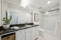 37 _ 21 Nemea Lane _ Bathroom with single-sink vanity and tub-shower combination