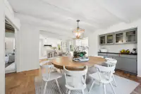 10 - 3435 Black Hawk Road - Dining room with built-in cabinetry and view of kitchen and living area