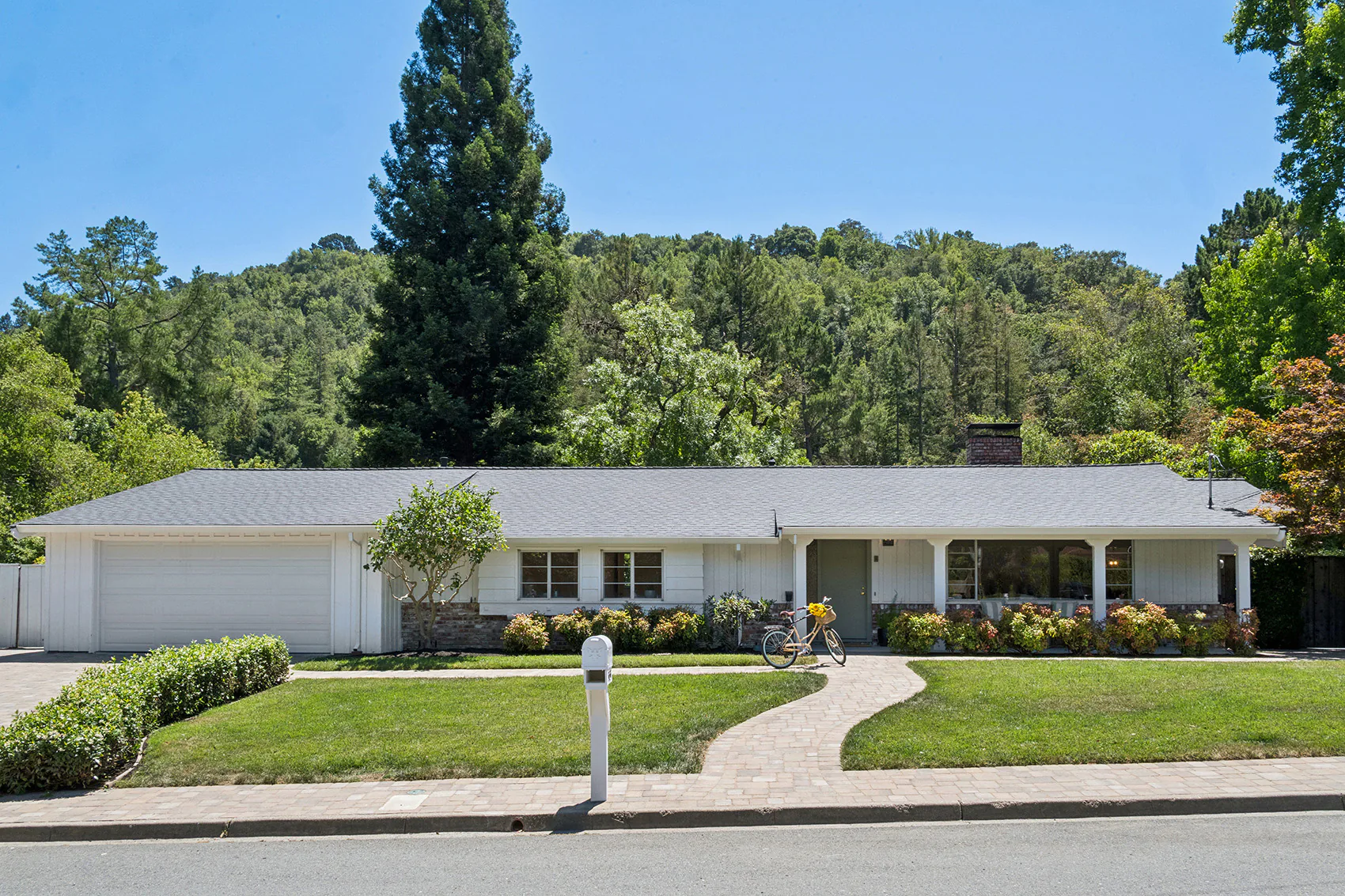 01 - 3435 Black Hawk Road - Front exterior of the property with lawn and attached garage